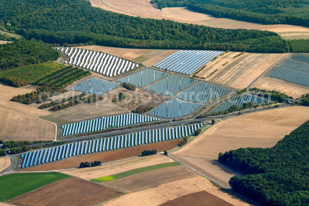 Aerial photograph Rohrbach - Rows of panels of a solar power plant and photovoltaic system on a field in Rohrbach in the state Bavaria, Germany