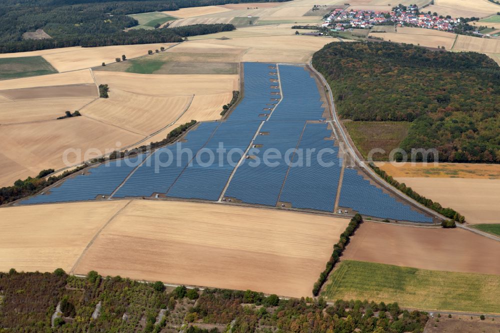 Thüngen from above - Rows of panels of a solar power plant and photovoltaic system on a field in Thuengen in the state Bavaria, Germany