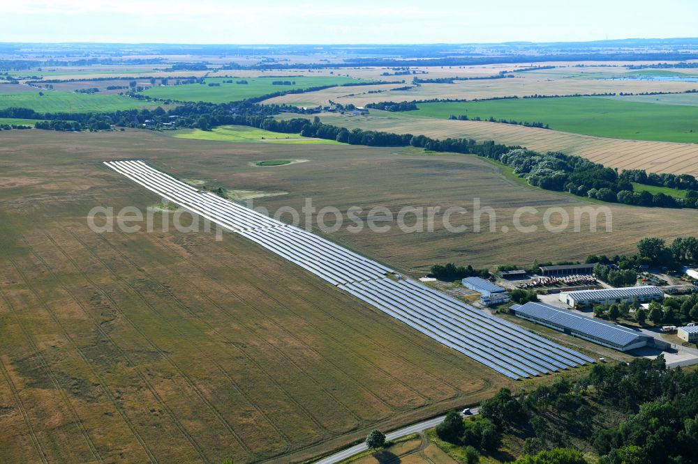 Aerial photograph Dedelow - Solar power plant and photovoltaic systems on the former runway with the tarmac area of the airfield in Dedelow in the state Brandenburg, Germany