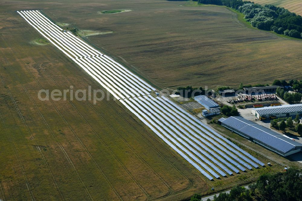 Dedelow from the bird's eye view: Solar power plant and photovoltaic systems on the former runway with the tarmac area of the airfield in Dedelow in the state Brandenburg, Germany