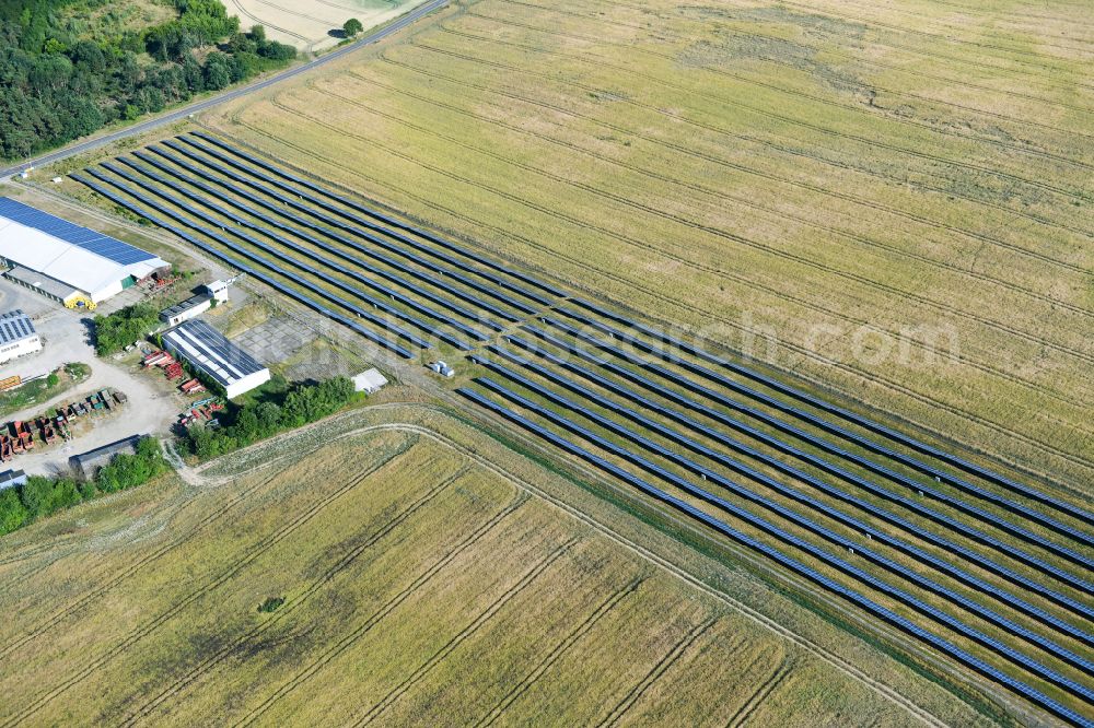 Aerial image Dedelow - Solar power plant and photovoltaic systems on the former runway with the tarmac area of the airfield in Dedelow in the state Brandenburg, Germany