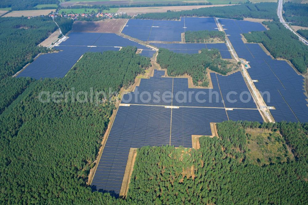 Schiebsdorf from the bird's eye view: Solar power plant and photovoltaic systems in a forest area in Schiebsdorf in the state Brandenburg, Germany