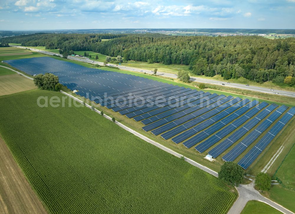 Aerial image Altenstadt - Photovoltaic system and solar power plant - rows of panels on the edge of the lanes of the motorway route and route of the BAB A 81 in Altenstadt Unterallgaeu in the state Bavaria, Germany