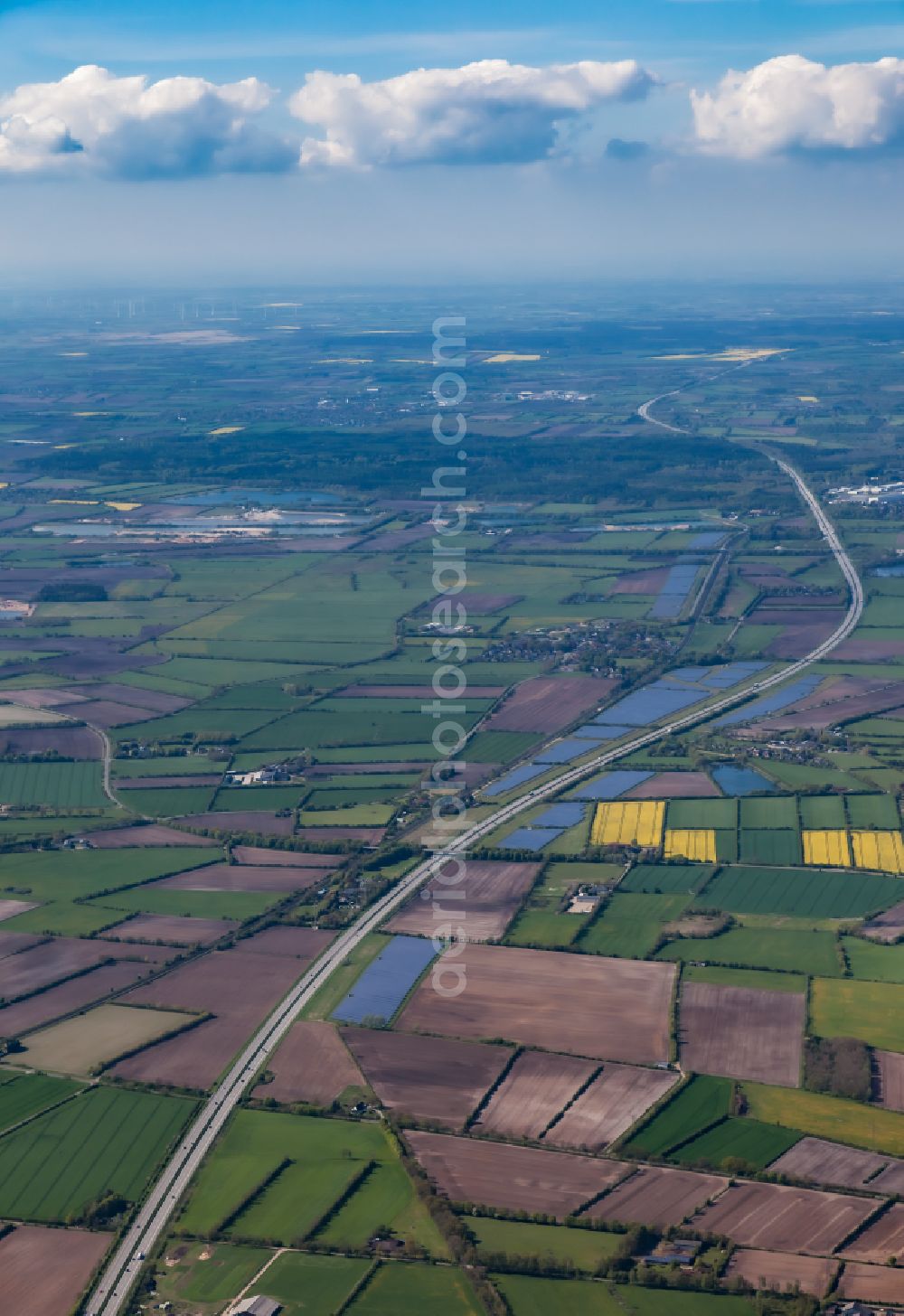 Oeversee from above - Photovoltaic system and solar power plant - rows of panels on the edge of the lanes of the motorway route and route of the BAB A 7 in Oeversee in the state Schleswig-Holstein, Germany