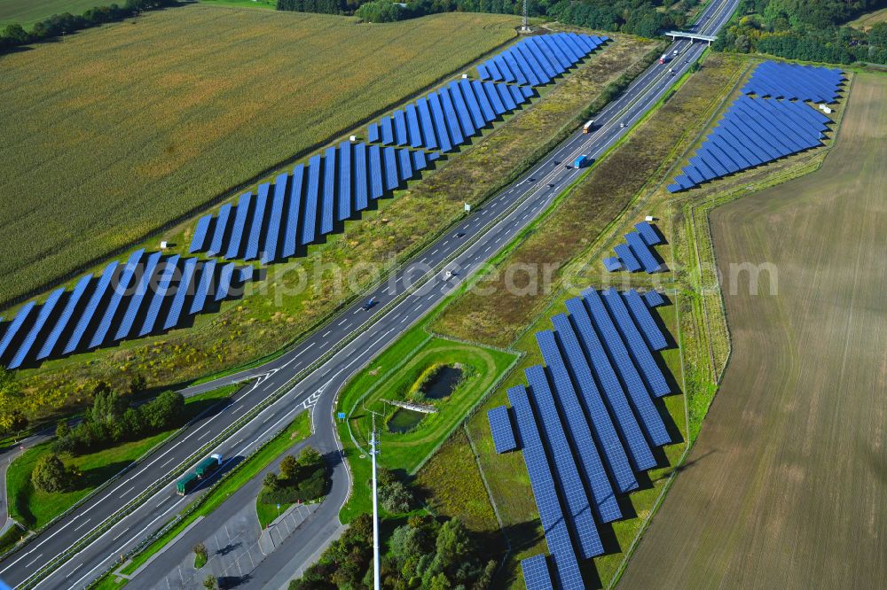 Silmersdorf from above - Photovoltaic system and solar power plant - rows of panels on the edge of the lanes of the motorway route and route of the BAB A 24 in Silmersdorf in the state Brandenburg, Germany