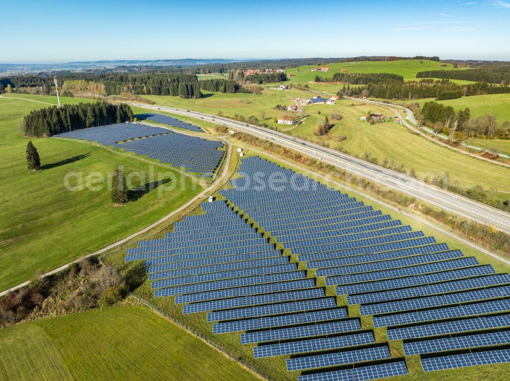 Aerial image Sulzberg - Photovoltaic system and solar power plant - rows of panels at the edge of the lanes of the motorway route and route of the BAB A81 in Sulzberg Oberallgaeu in the federal state of Bavaria, Germany