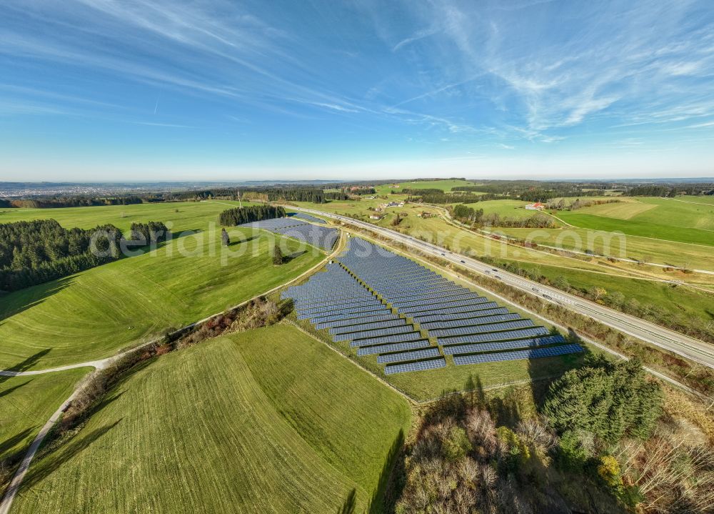 Aerial photograph Sulzberg - Photovoltaic system and solar power plant - rows of panels at the edge of the lanes of the motorway route and route of the BAB A81 in Sulzberg Oberallgaeu in the federal state of Bavaria, Germany