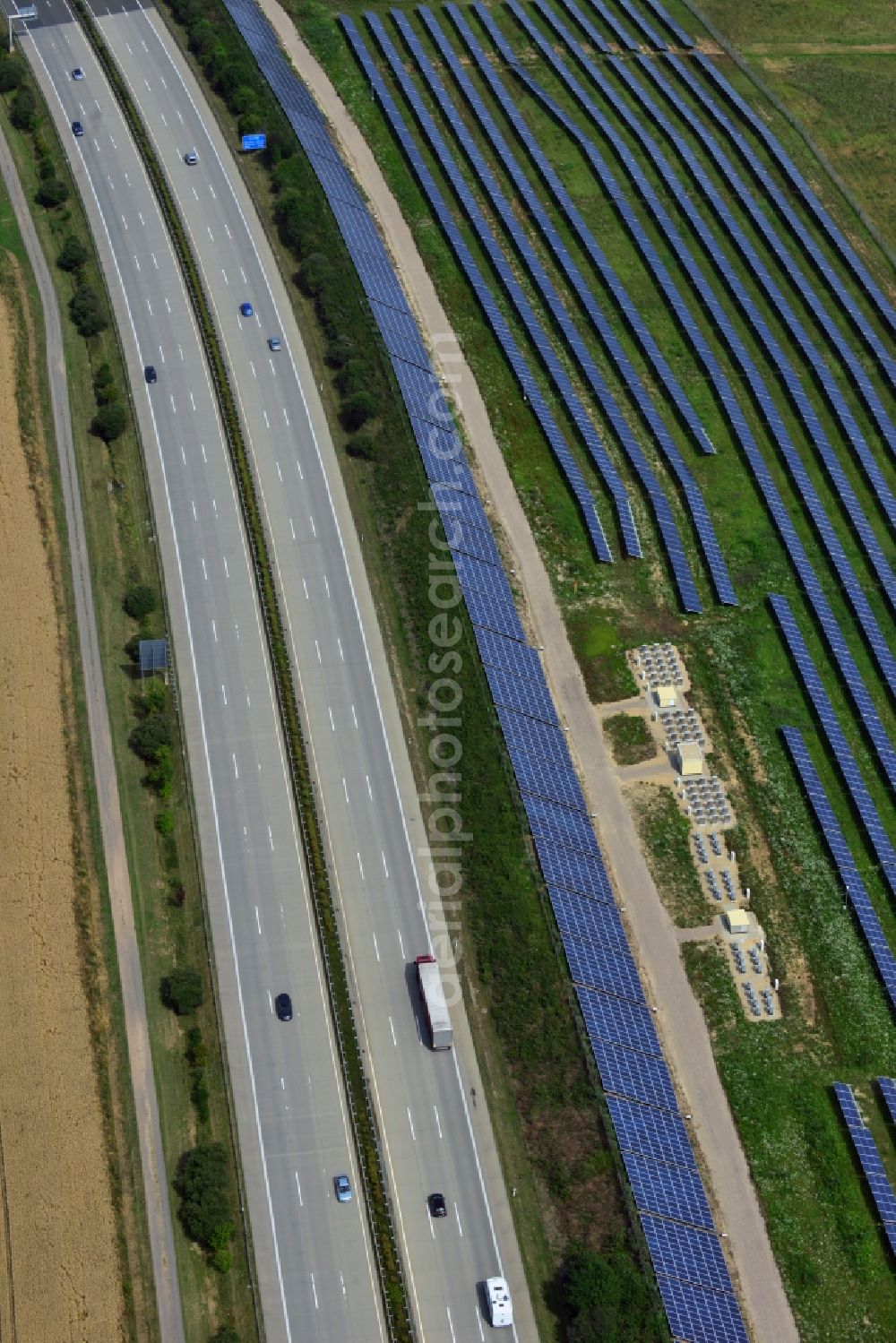 Rüdersdorf from the bird's eye view: Solar panels of the solar power plant along the motorway E4 motorway - A40 at Ruedersdorf in Thuringia