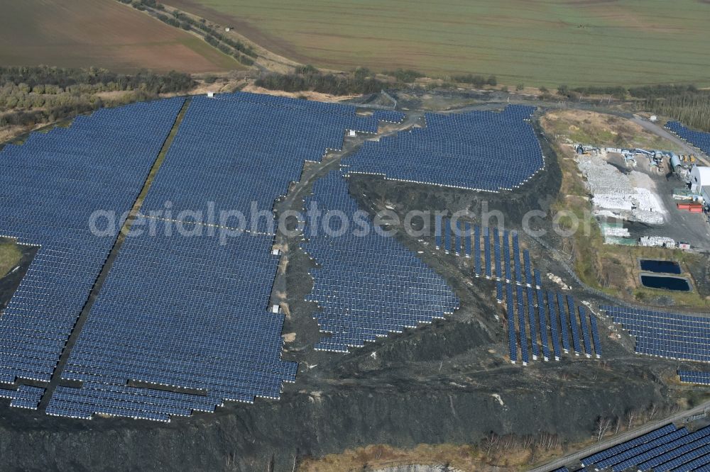 Eisleben, Lutherstadt from above - Panel rows of photovoltaic and solar farm or solar power plant in Eisleben, Lutherstadt in the state Saxony-Anhalt