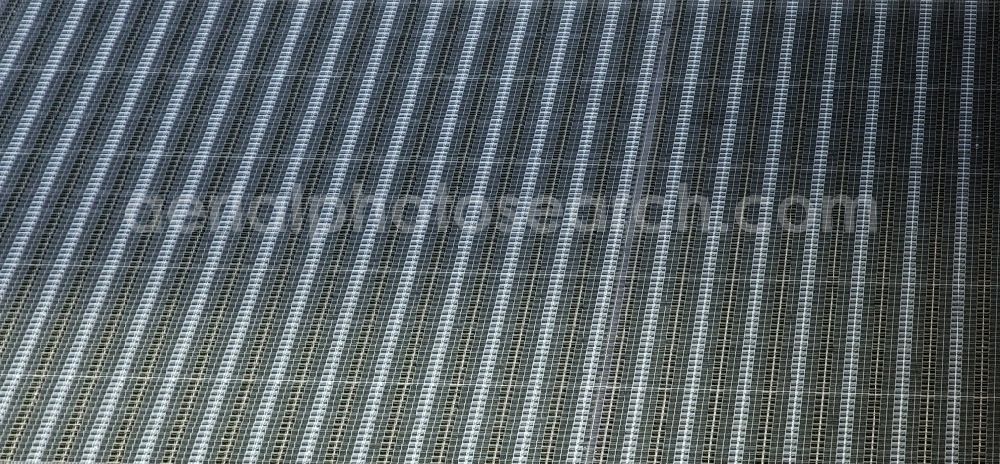 Apollensdorf from the bird's eye view: Panel rows of photovoltaic and solar farm or solar power plant in Apollensdorf in the state Saxony-Anhalt, Germany