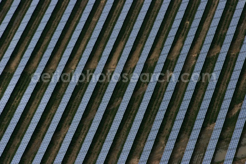 Aerial image Apollensdorf - Panel rows of photovoltaic and solar farm or solar power plant in Apollensdorf in the state Saxony-Anhalt, Germany