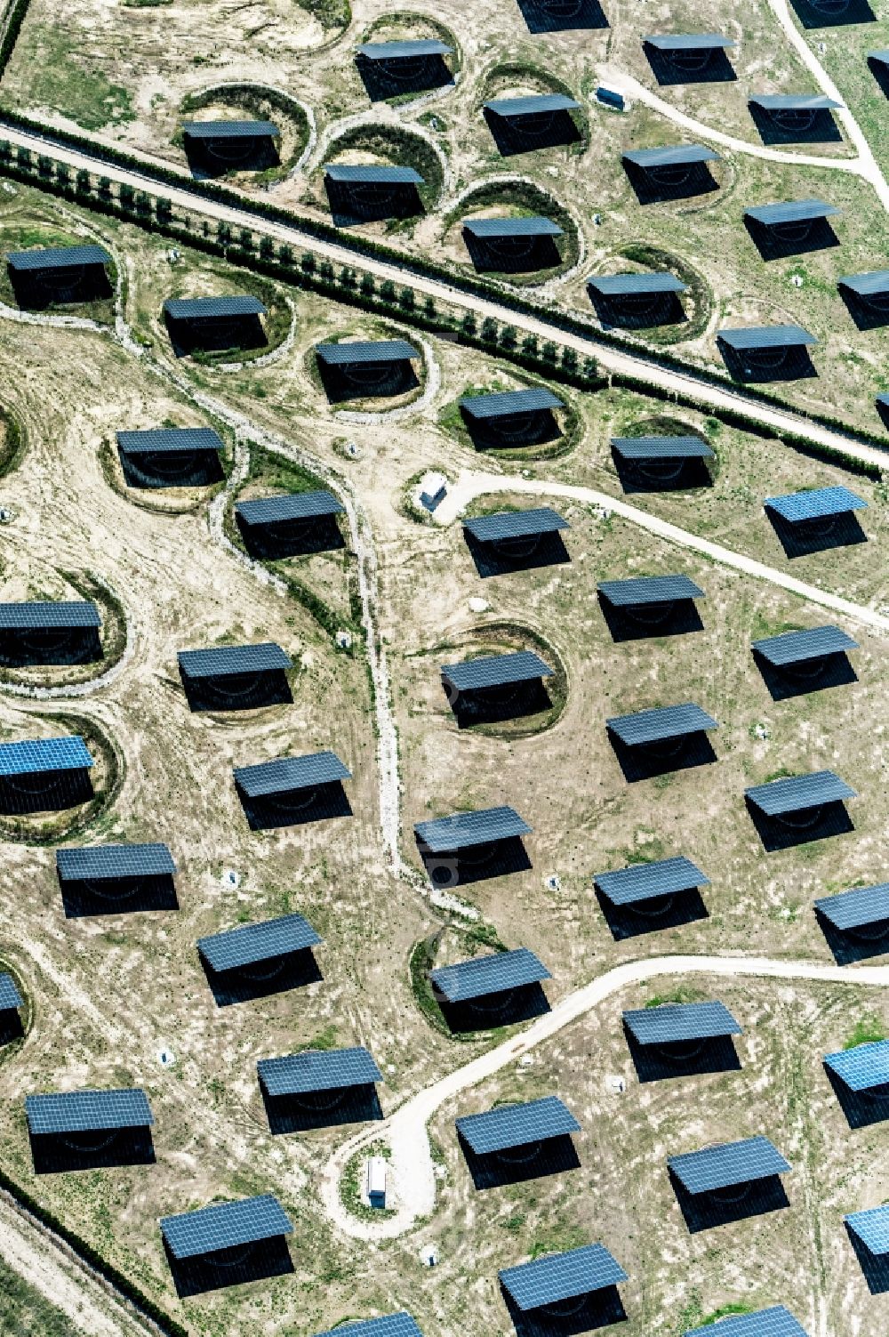 Apulien from above - Panel rows of photovoltaic and solar farm or solar power plant in Apulien in Italy