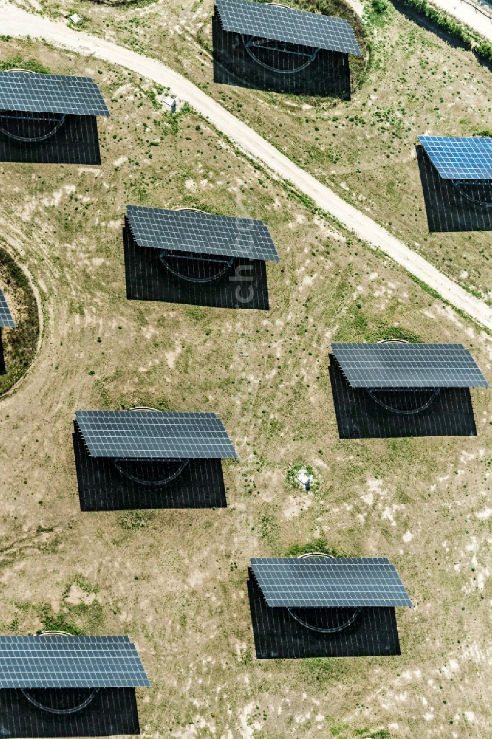 Apulien from the bird's eye view: Panel rows of photovoltaic and solar farm or solar power plant in Apulien in Italy