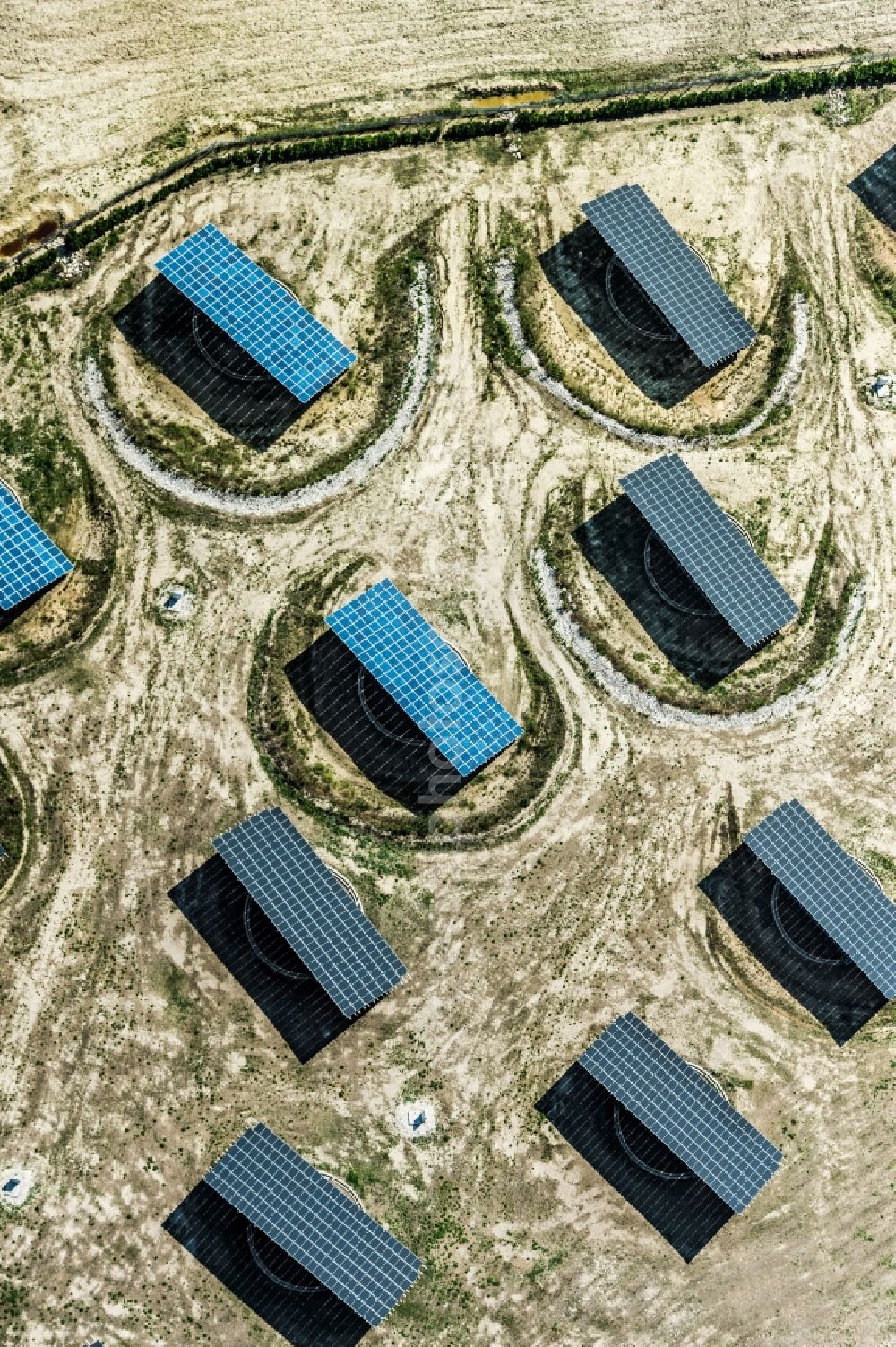 Aerial image Apulien - Panel rows of photovoltaic and solar farm or solar power plant in Apulien in Italy