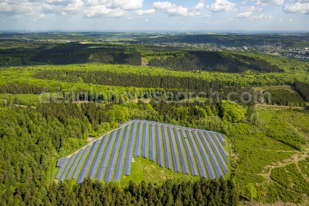 Arnsberg from above - Panel rows of photovoltaic and solar farm or solar power plant in Arnsberg in the state North Rhine-Westphalia