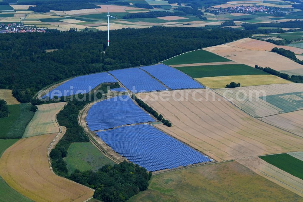 Berolzheim from the bird's eye view: Panel rows of photovoltaic and solar farm or solar power plant in Berolzheim in the state Baden-Wurttemberg, Germany