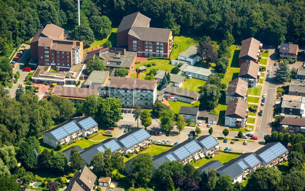 Bottrop from the bird's eye view: Panel rows of photovoltaic and solar farm or solar power plant buldings roofs on Goerkenstrasse in Bottrop in the state North Rhine-Westphalia