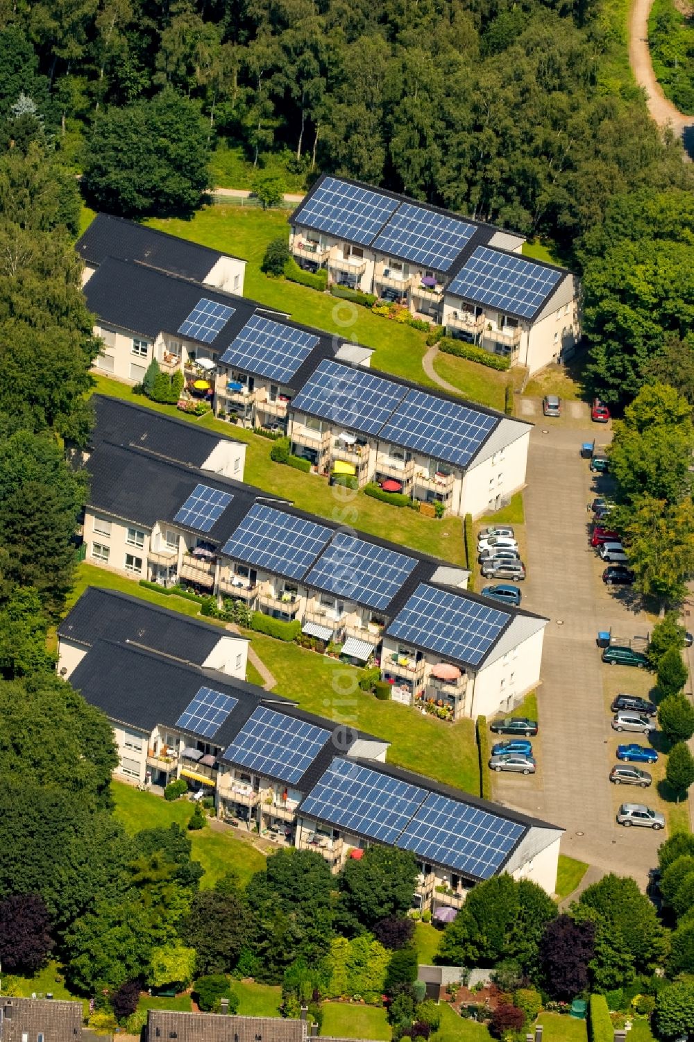 Bottrop from the bird's eye view: Panel rows of photovoltaic and solar farm or solar power plant buldings roofs on Goerkenstrasse in Bottrop in the state North Rhine-Westphalia