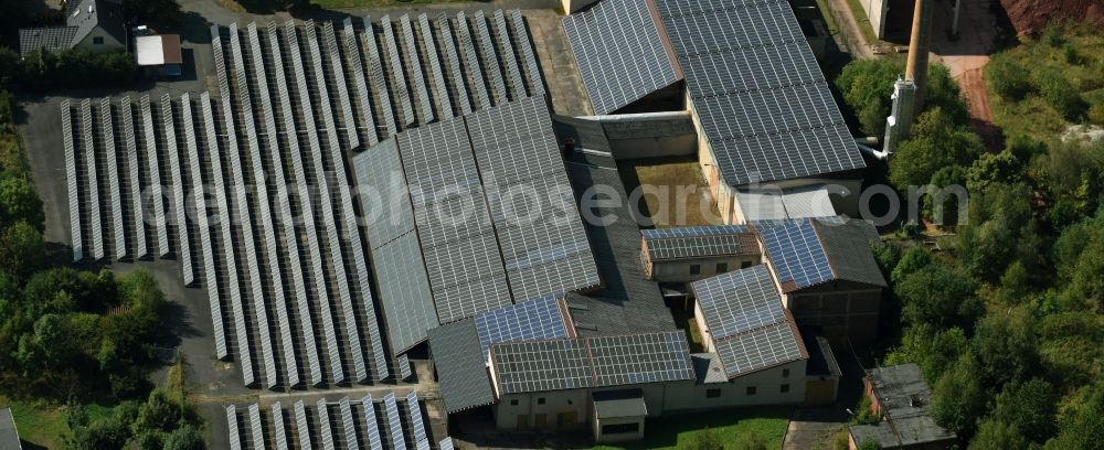 Leubnitz from the bird's eye view: Panel rows of photovoltaic and solar farm or solar power plant on the roof areas at the Wettiner Strasse in Leubnitz in the state Saxony