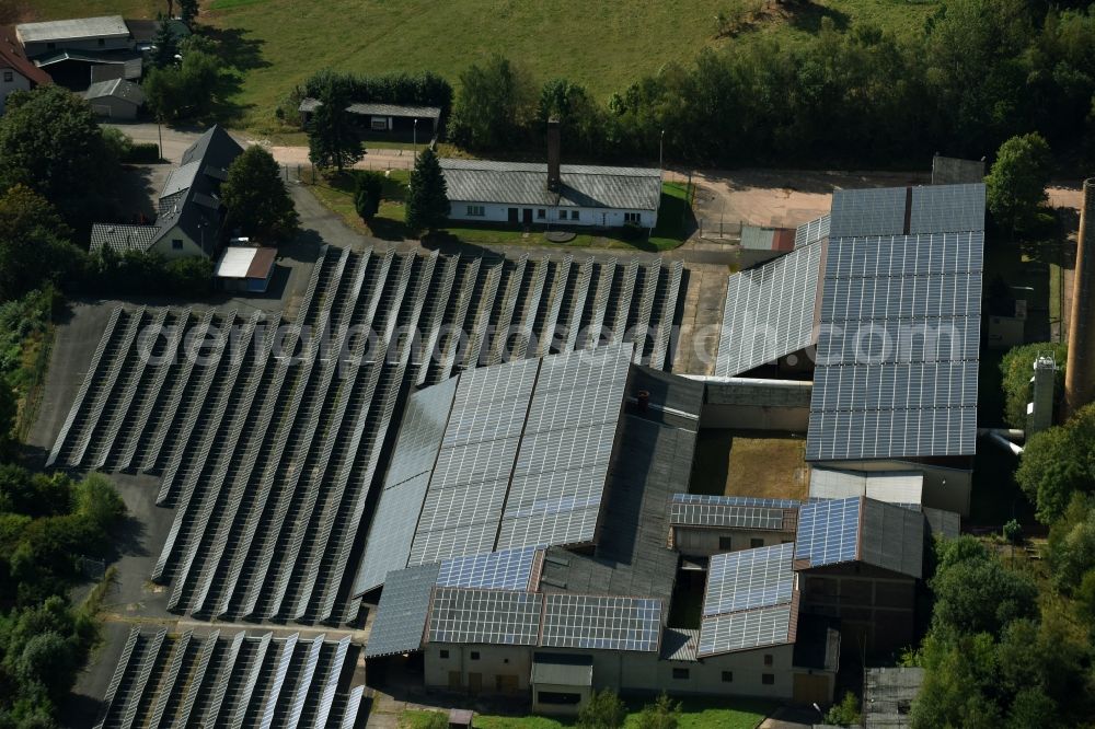 Aerial photograph Leubnitz - Panel rows of photovoltaic and solar farm or solar power plant on the roof areas at the Wettiner Strasse in Leubnitz in the state Saxony