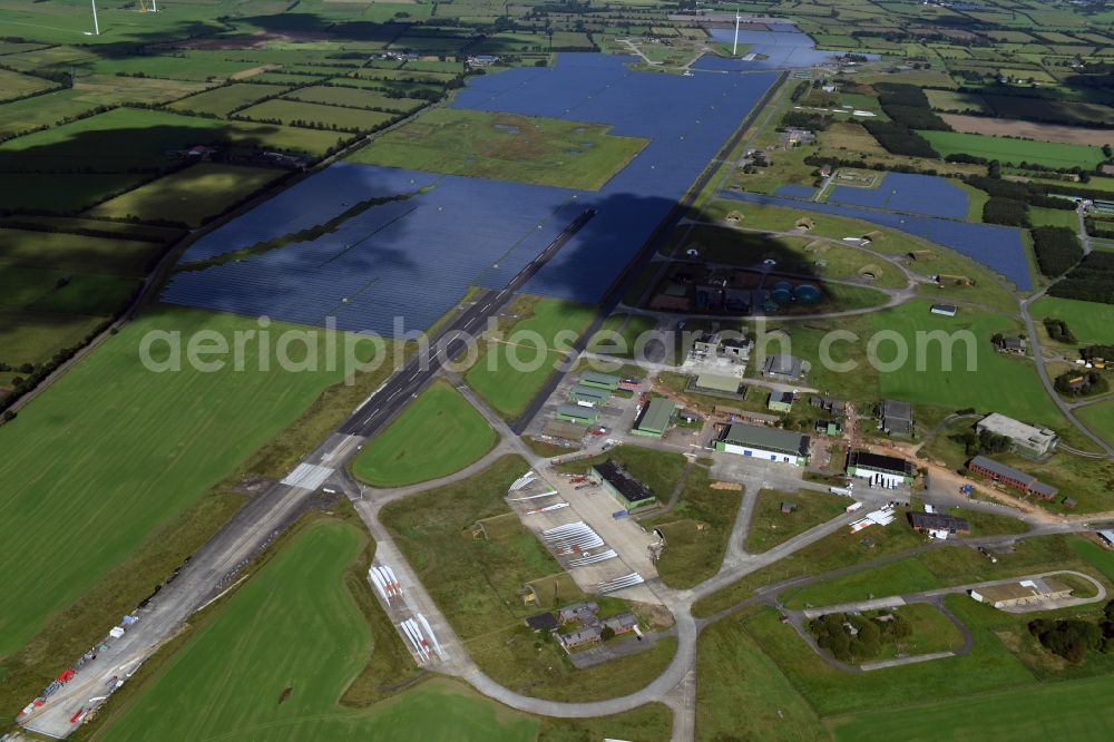 Aerial image Eggebek - Panel rows of photovoltaic and solar farm or solar power plant of the company Moehring Energie GmbH and mainova AG in Eggebek in the state Schleswig-Holstein