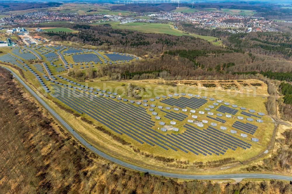 Bad Arolsen from the bird's eye view: Panel rows of photovoltaic and solar farm or solar power plant on the former Gelaende of Prinz-Eugen-Kaserne in Bad Arolsen in the state Hesse, Germany