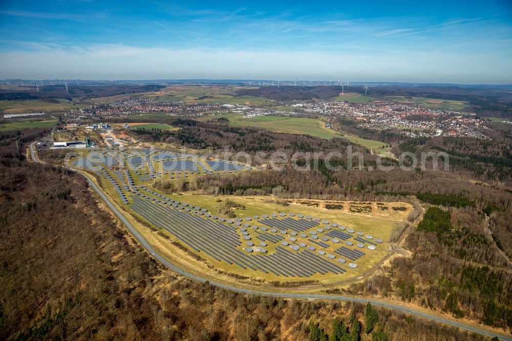 Aerial image Bad Arolsen - Panel rows of photovoltaic and solar farm or solar power plant on the former Gelaende of Prinz-Eugen-Kaserne in Bad Arolsen in the state Hesse, Germany