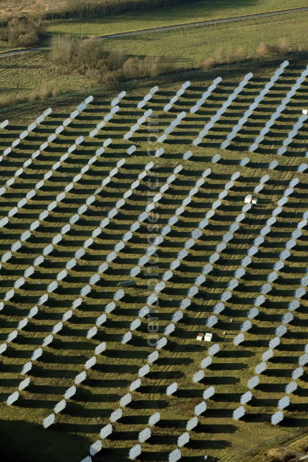 Rüdersdorf from the bird's eye view: Panel rows of photovoltaic and solar farm or solar power plant Eichenstrasse in Ruedersdorf in the state Brandenburg