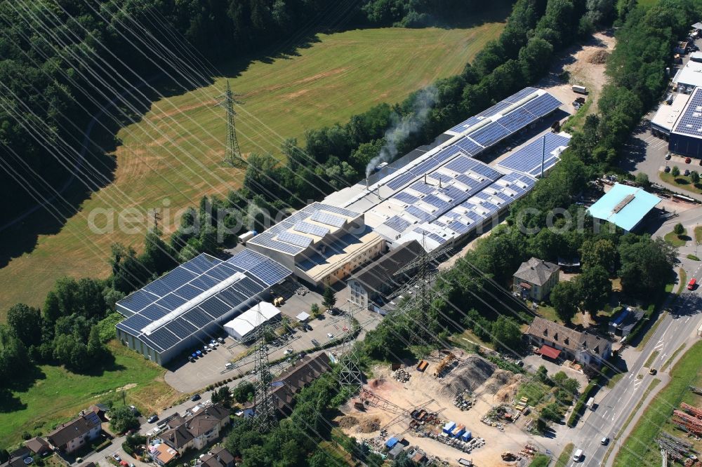 Wehr from above - Panel rows of photovoltaic and solar farm or solar power plant on the company's roof and roof areas of the Dreilaendereck GmbH in Wehr in the state Baden-Wuerttemberg