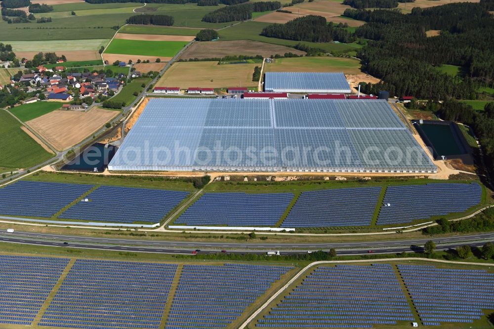 Aerial image Wonsees - Panel rows of photovoltaic and solar farm or solar power plant Jura-Solarpark on BAB A70 in Wonsees in the state Bavaria, Germany