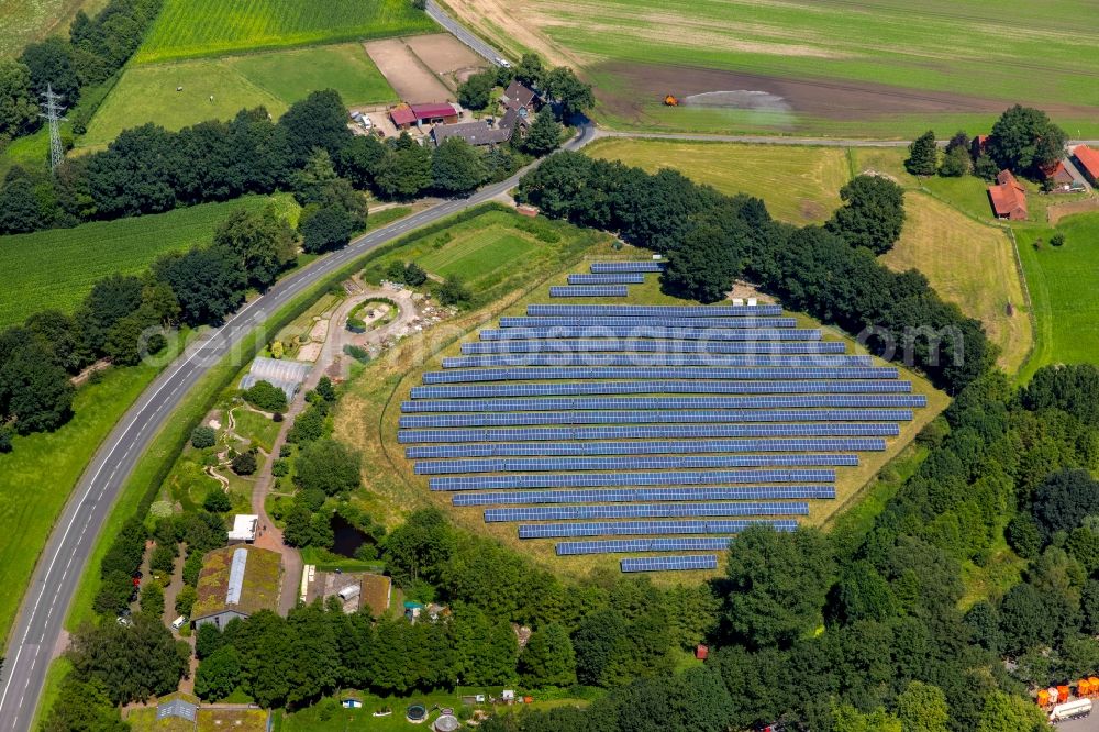 Aerial photograph Dorsten - Panel Rows of photovoltaic system and solar farm or solar power plant In Koehl at the Wienbach Street in Dorsten in North Rhine-Westphalia. This is a Projet Dorstener energy cooperative