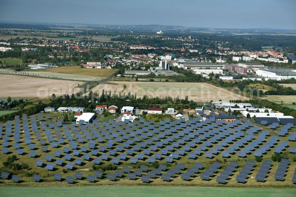 Grimma from the bird's eye view: Panel rows of photovoltaic and solar farm or solar power plant der Kirchner Solar Group GmbH in Grimma in the state Saxony