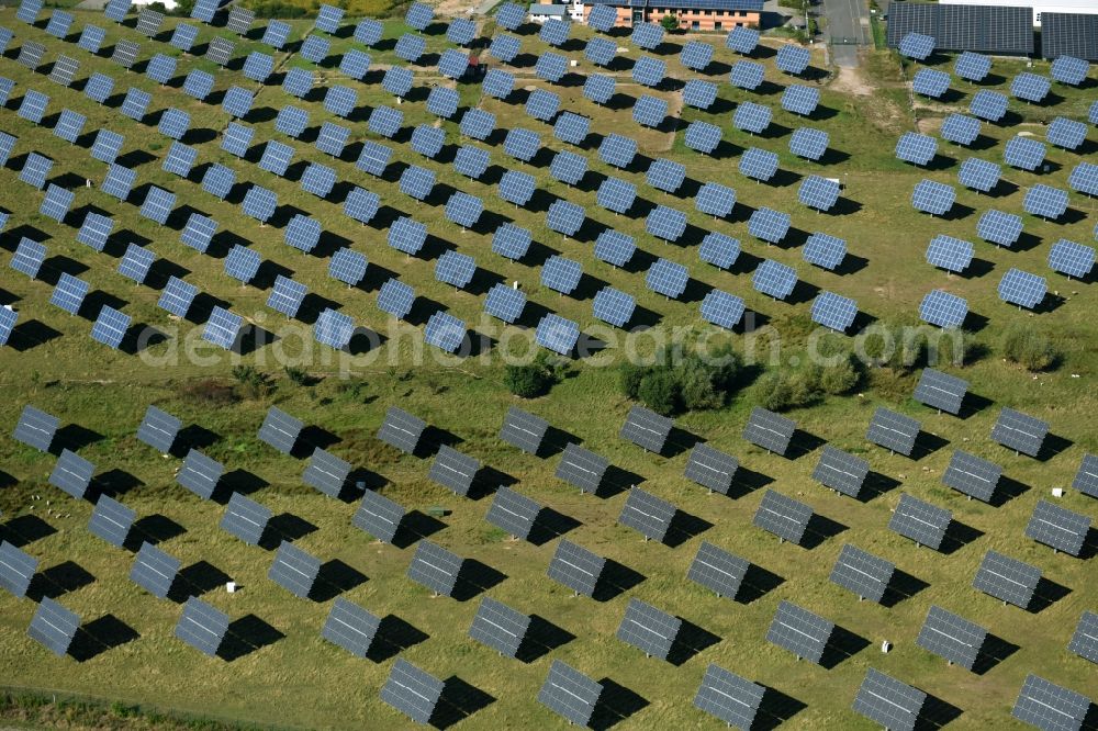 Grimma from above - Panel rows of photovoltaic and solar farm or solar power plant der Kirchner Solar Group GmbH in Grimma in the state Saxony