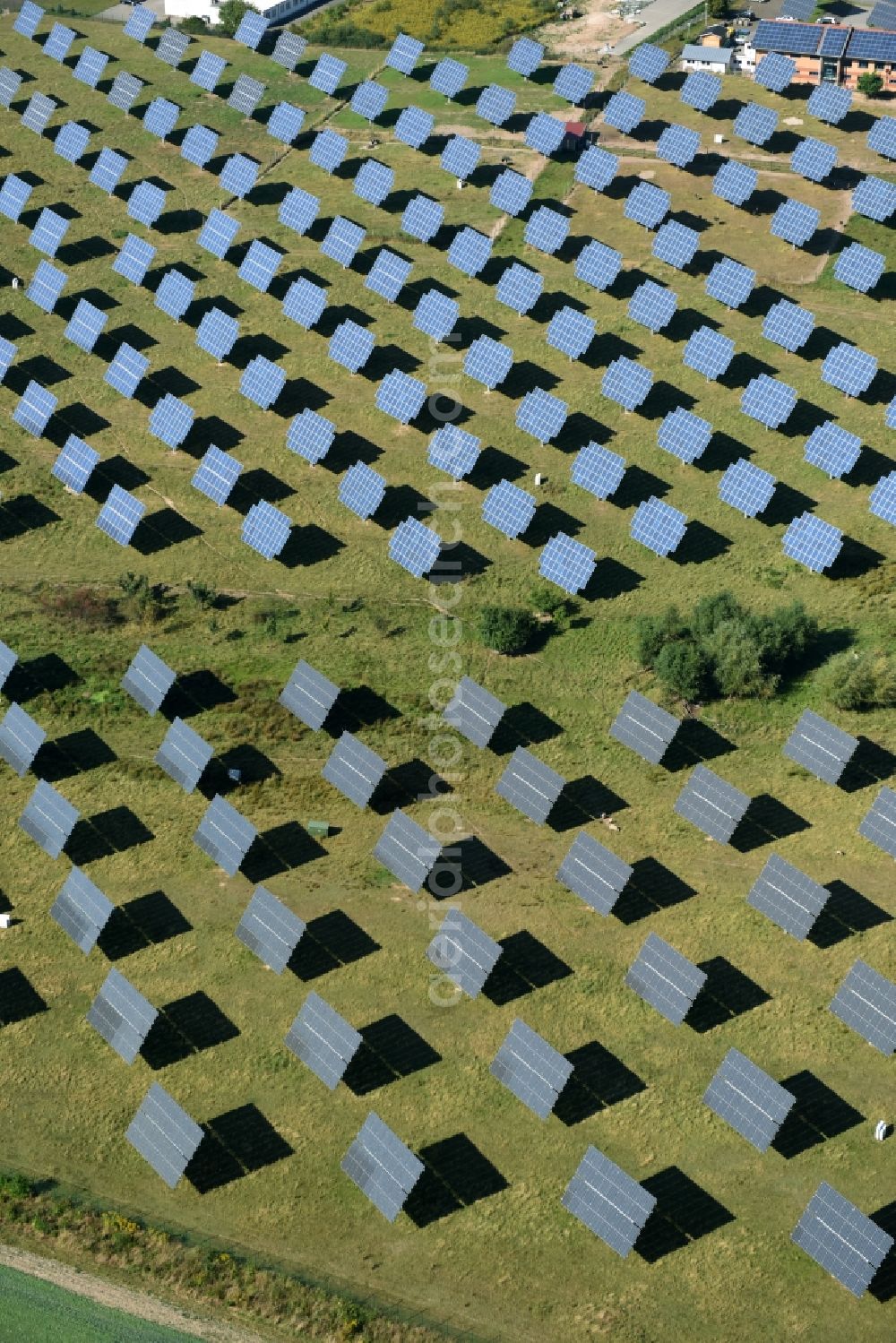 Grimma from the bird's eye view: Panel rows of photovoltaic and solar farm or solar power plant der Kirchner Solar Group GmbH in Grimma in the state Saxony