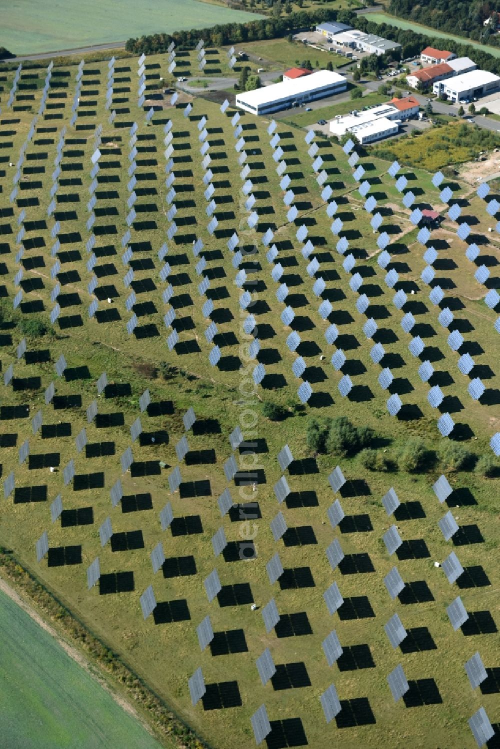 Grimma from the bird's eye view: Panel rows of photovoltaic and solar farm or solar power plant der Kirchner Solar Group GmbH in Grimma in the state Saxony