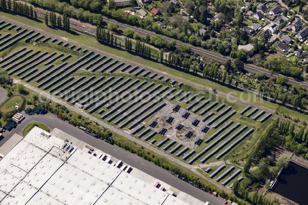 Berlin from above - Panel rows of photovoltaic and solar farm or solar power plant in the district Mariendorf in Berlin, Germany