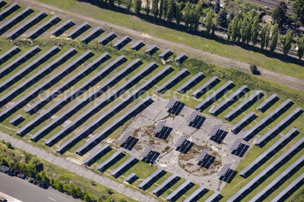 Aerial image Berlin - Panel rows of photovoltaic and solar farm or solar power plant in the district Mariendorf in Berlin, Germany