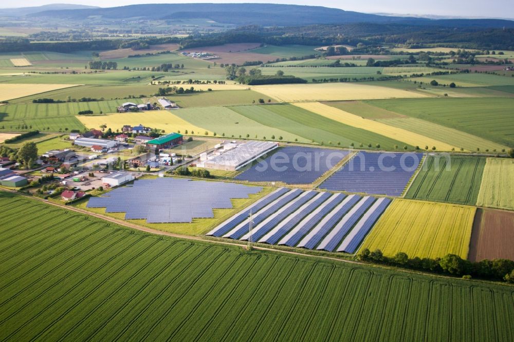 Aerial image Marienmünster - Panel rows of photovoltaic and solar farm or solar power plant in the district Bredenborn in Marienmuenster in the state North Rhine-Westphalia