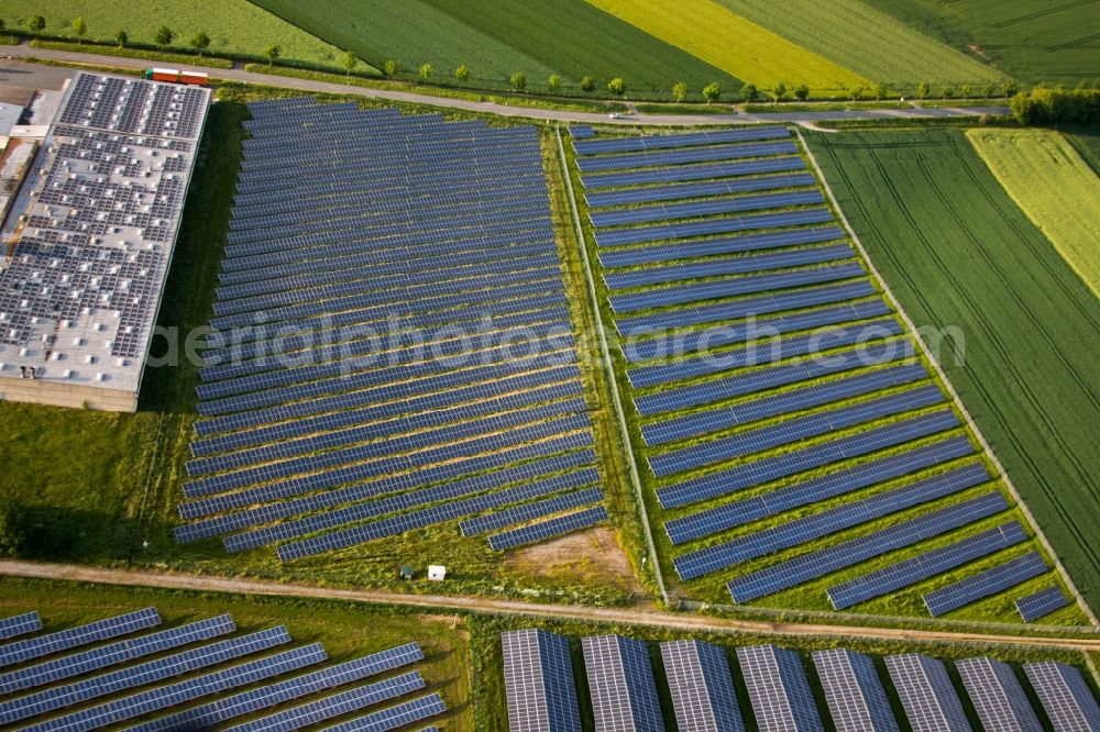 Aerial photograph Marienmünster - Panel rows of photovoltaic and solar farm or solar power plant in the district Bredenborn in Marienmuenster in the state North Rhine-Westphalia