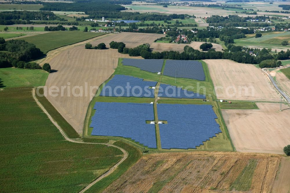 Aerial photograph Otterwisch - Panel rows of photovoltaic and solar farm or solar power plant in Otterwisch in the state Saxony