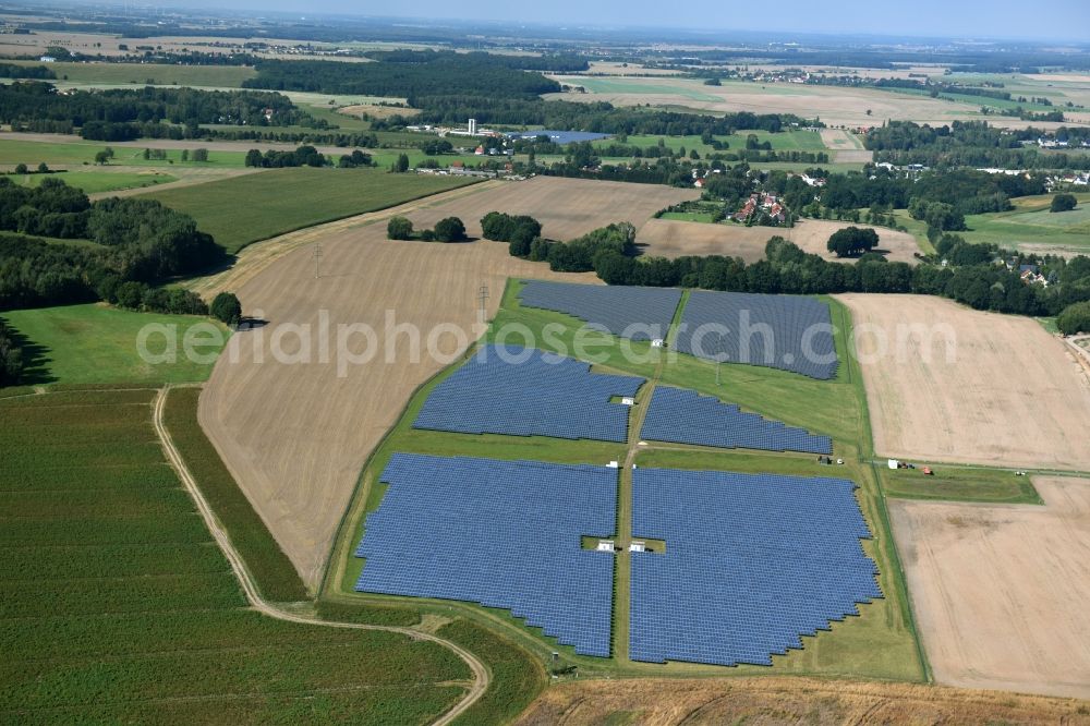 Otterwisch from above - Panel rows of photovoltaic and solar farm or solar power plant in Otterwisch in the state Saxony