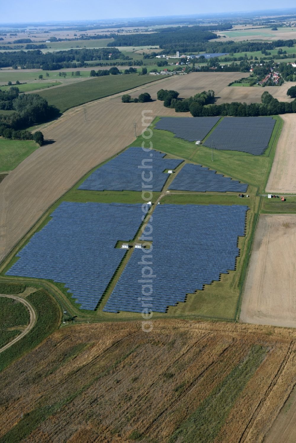 Otterwisch from above - Panel rows of photovoltaic and solar farm or solar power plant in Otterwisch in the state Saxony