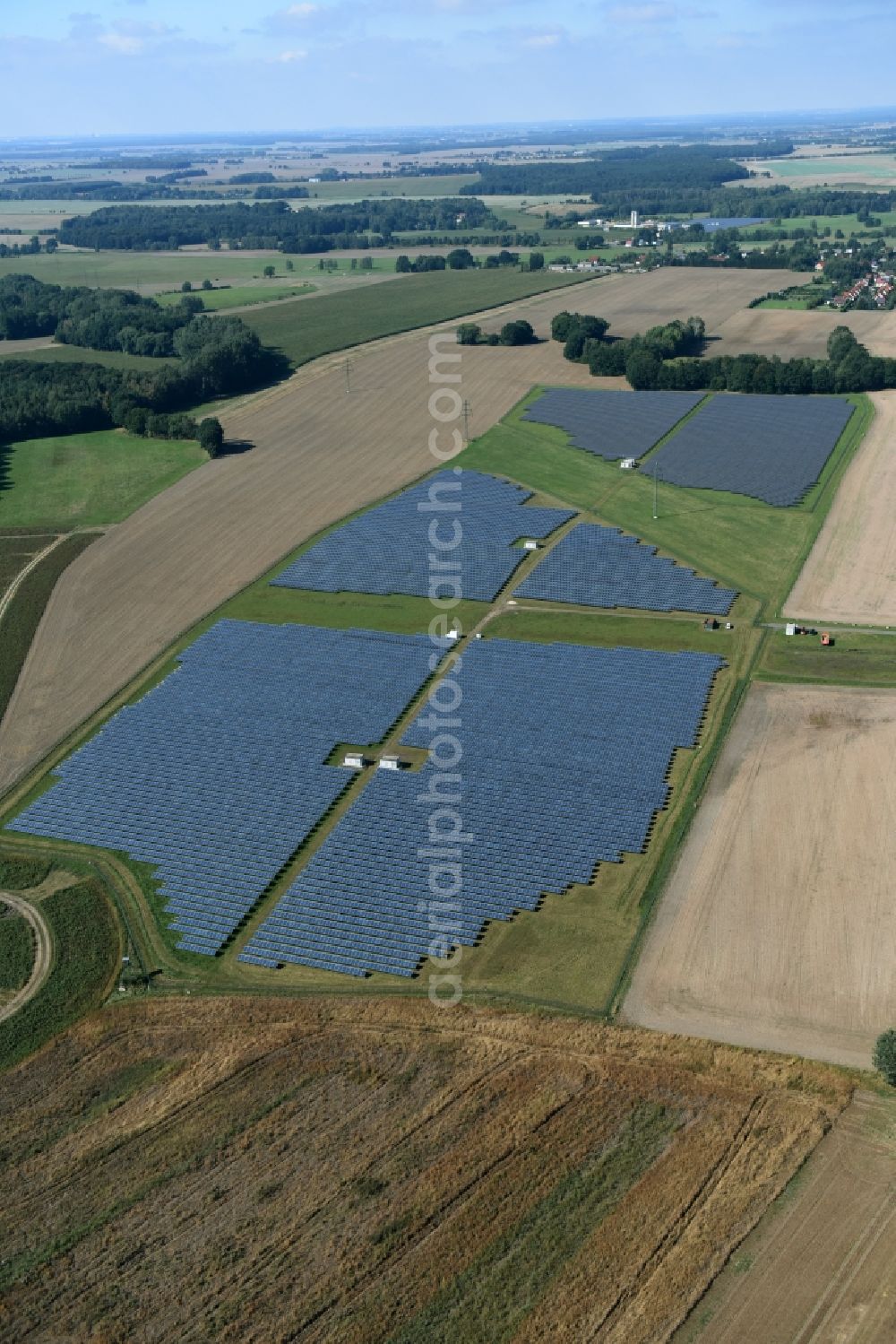 Aerial image Otterwisch - Panel rows of photovoltaic and solar farm or solar power plant in Otterwisch in the state Saxony