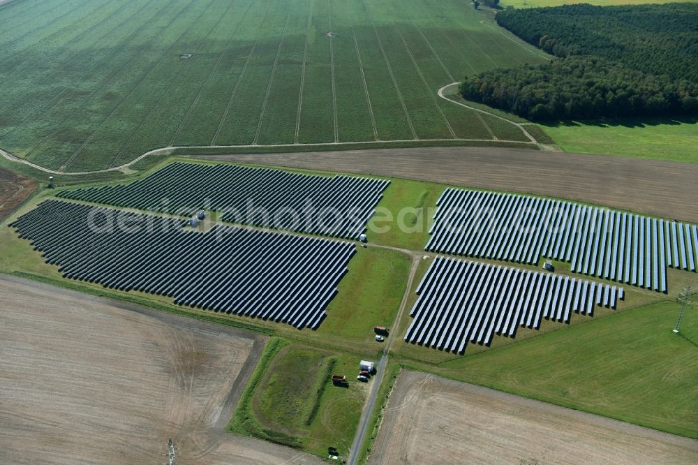 Aerial photograph Otterwisch - Panel rows of photovoltaic and solar farm or solar power plant in Otterwisch in the state Saxony