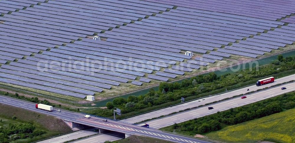 Rödgen from above - Panel rows of photovoltaic and solar farm or solar power plant in Roedgen in the state Saxony-Anhalt, Germany