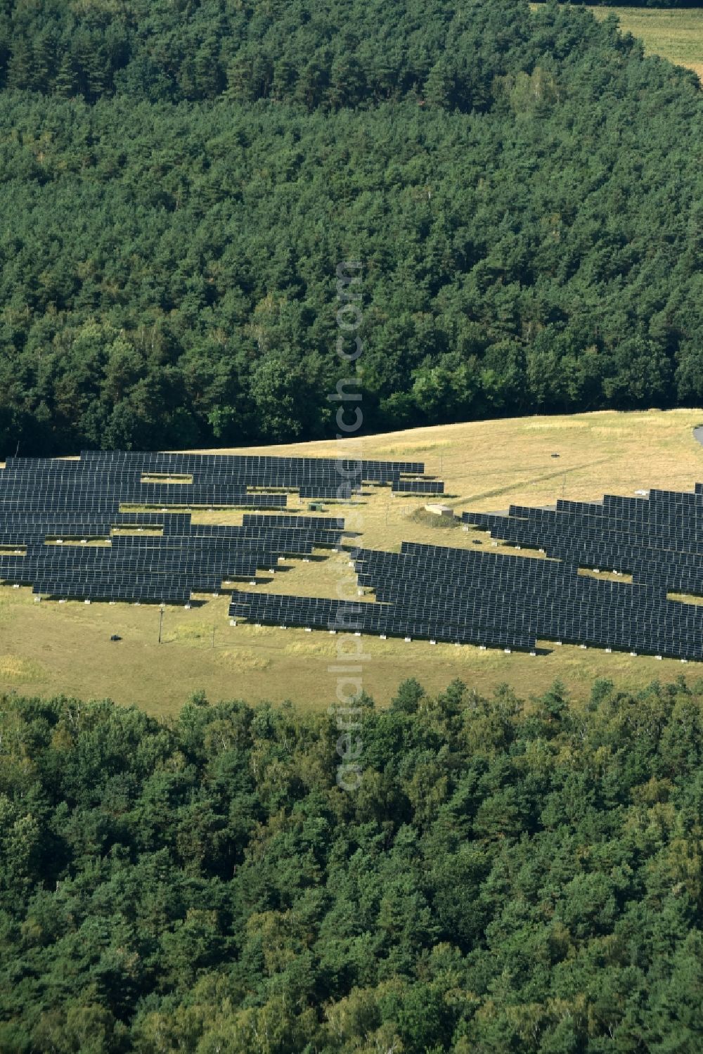 Lutherstadt Wittenberg from the bird's eye view: Panel rows of photovoltaic and solar farm or solar power plant on a renatured landfill in Tonmark in the state Saxony-Anhalt