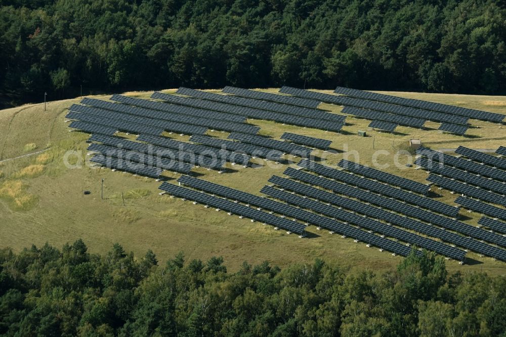 Aerial image Lutherstadt Wittenberg - Panel rows of photovoltaic and solar farm or solar power plant on a renatured landfill in Tonmark in the state Saxony-Anhalt