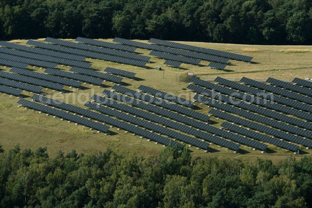 Aerial photograph Lutherstadt Wittenberg - Panel rows of photovoltaic and solar farm or solar power plant on a renatured landfill in Tonmark in the state Saxony-Anhalt