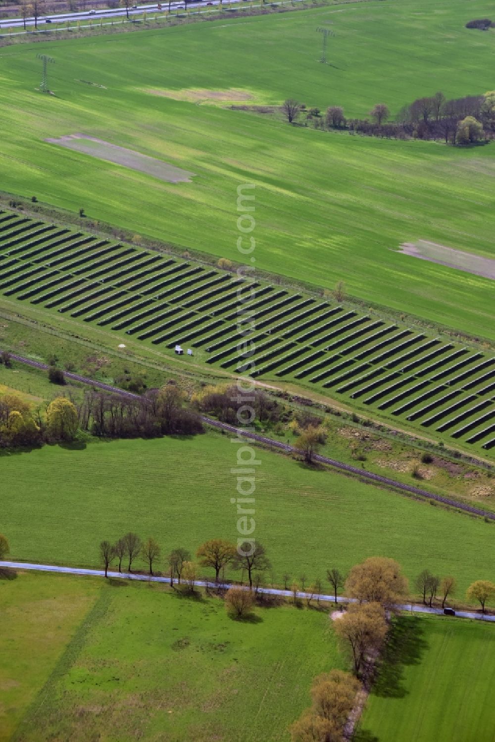 Vogelsdorf from above - Panel rows of photovoltaic and solar farm or solar power plant south of Vogelsdorf in the state Brandenburg