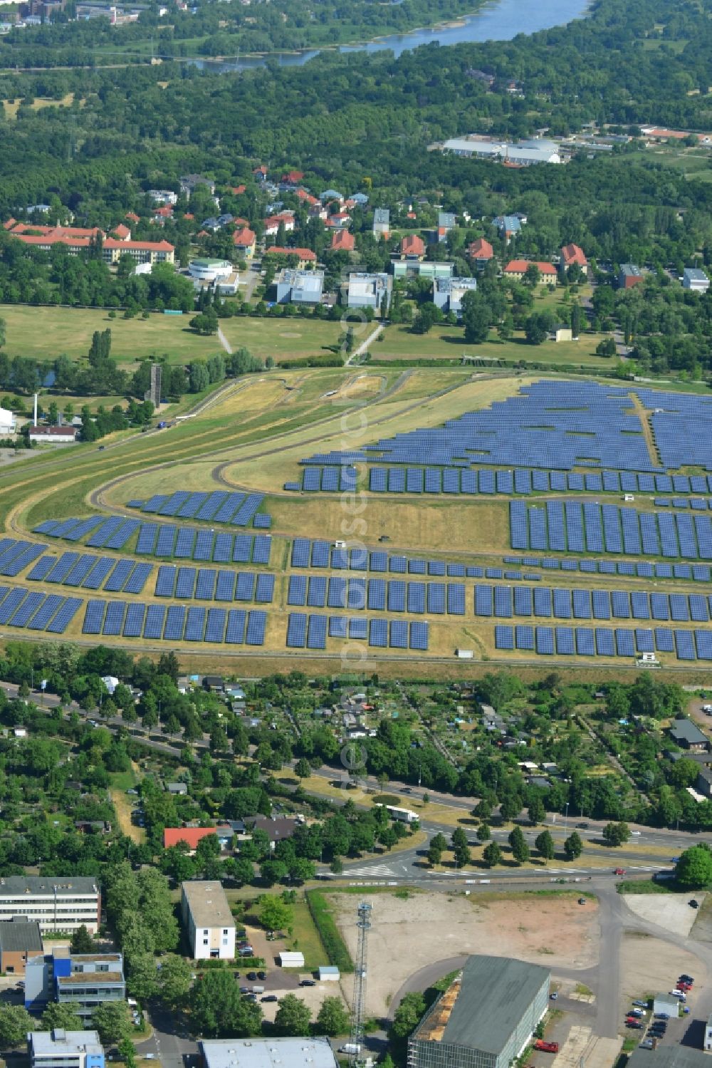 Magdeburg from above - Panel rows of photovoltaic and solar farm or solar power plant on the disused dump landfill on Cracauer Anger in Magdeburg in the state Saxony-Anhalt